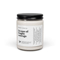 Candle jar with a black lid and white label on a white background