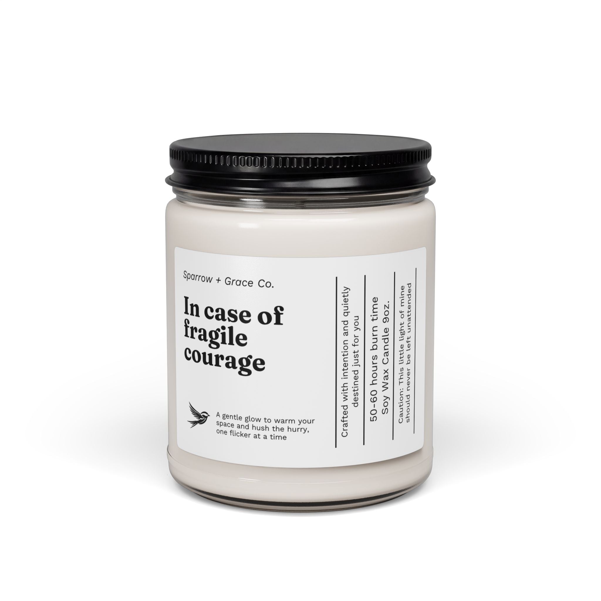 Candle jar with a black lid and white label on a white background
