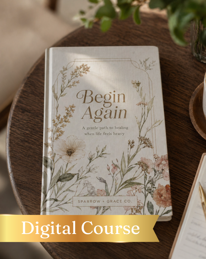 Book titled 'Begin Again' with floral design on a wooden surface, featuring a digital course label.